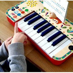 Tecles amb signes de color de l'Animambo Teclat Djeco – segueix els mateixos colors a la partitura i toca la melodia